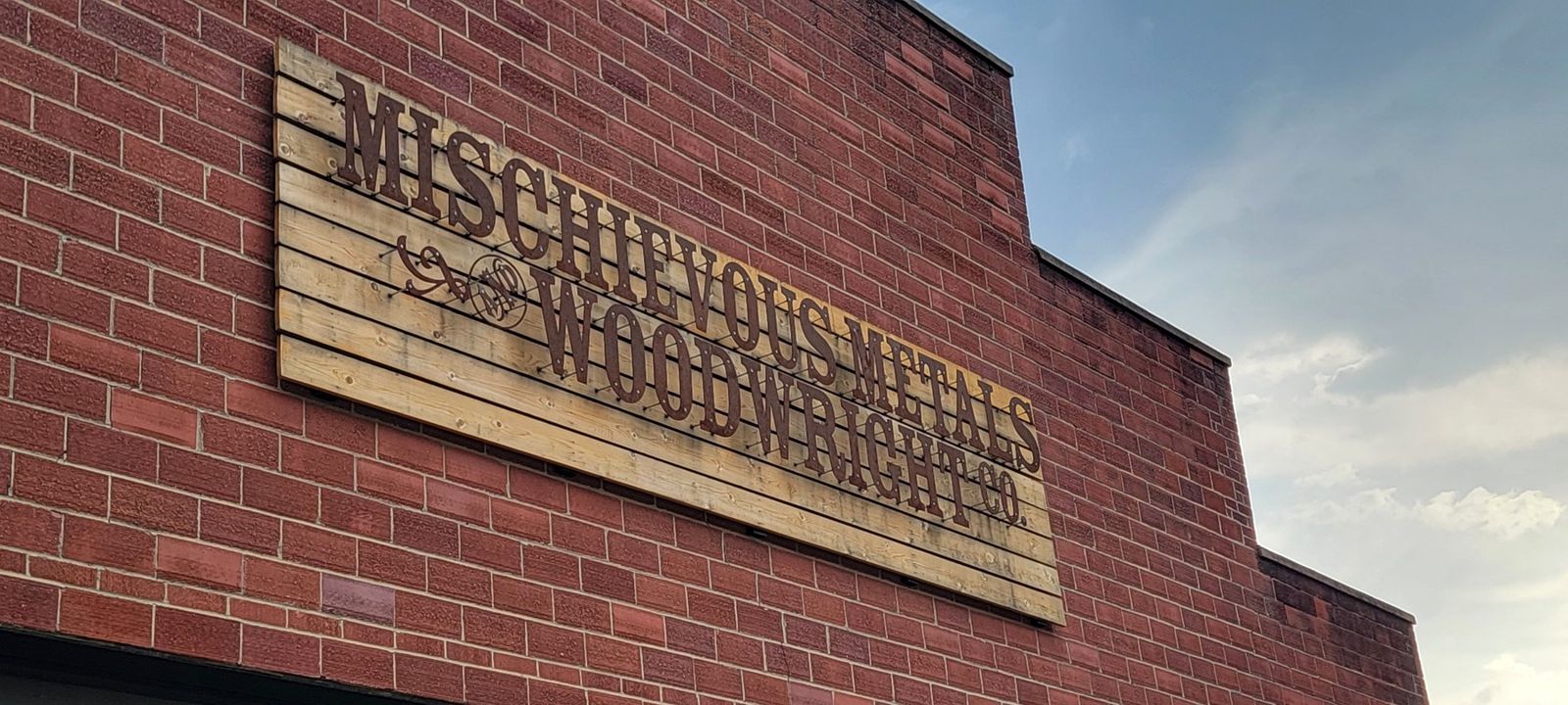 Mischievous Metals and WoodWright Co. sign